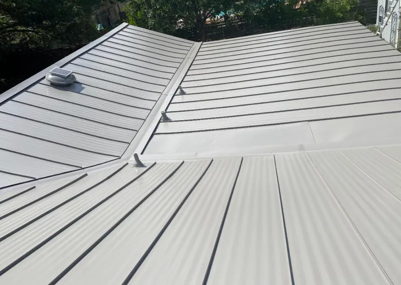 Solar attic fan installed on a metal roof for Roof Ventilation in St. Francis